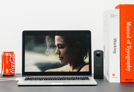 PARIS, FRANCE - SEP 13, 2017: Minimalist creative room and Safari Browser on MacBook Pro laptop showcasing Apple Keynote website presenting the new iPhone X 10 Face ID recognitionのeditorial素材