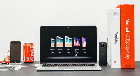 PARIS, FRANCE - SEP 13, 2017: Minimalist creative room and Safari Browser on MacBook Pro laptop showcasing Apple Keynote website with  Phil Schiller Apple marketing chief presenting the new iPhone X 10 and iPhone 8 and 8 Plusのeditorial素材