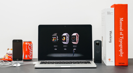 PARIS, FRANCE - SEP 13, 2017: Minimalist creative room  Safari Browser open on MacBook Pro laptop showcasing Apple Keynote website - Apple COO Jeff Williams presenting the Apple Watch 3 availability priceのeditorial素材