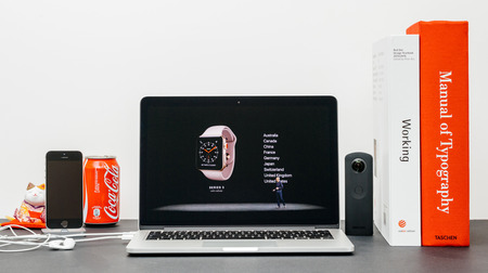 PARIS, FRANCE - SEP 13, 2017: Minimalist creative room  Safari Browser open on MacBook Pro laptop showcasing Apple Keynote website - Apple COO Jeff Williams presenting the Apple Watch 3 availability to orderのeditorial素材
