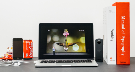 PARIS, FRANCE - SEP 13, 2017: Minimalist creative room with Safari Browser open on MacBook Pro laptop showcasing Apple Keynote website with Eddy Cue Apple services chief presenting the Apple TV 4k vs 4k hdrのeditorial素材