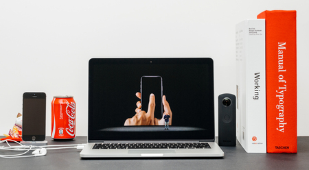 PARIS, FRANCE - SEP 13, 2017: Minimalist creative room and Safari Browser on MacBook Pro laptop showcasing Apple Keynote website with Phil Schiller Apple marketing chief  presenting the new iPhone X 10 oled touch screenのeditorial素材