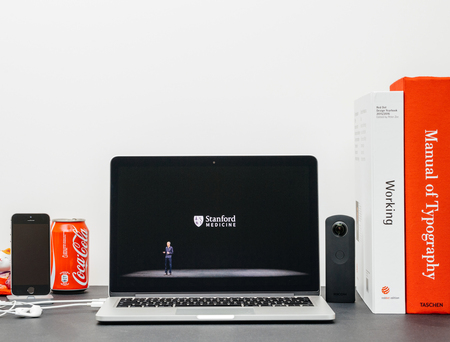 PARIS, FRANCE - SEP 13, 2017: Minimalist creative room  Safari Browser open on MacBook Pro laptop showcasing Apple Keynote website - Apple COO Jeff Williams presenting the Apple Watch 3 Stanford Medicine cooperationのeditorial素材