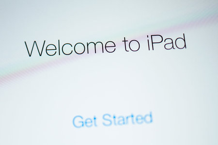 PARIS, FRANCE - SEP 12, 2014: Welcome to iPad signage on the modern retina display of an personal tablet computer made by Apple Computersのeditorial素材