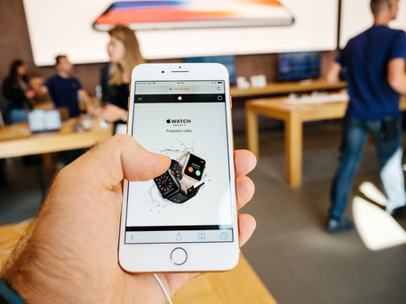 PARIS, FRANCE - SEP 22, 2017: New iPhone 8 and iPhone 8 Plus, as well the updated Apple Watch, Apple TV goes on sale today in Apple Store with customer website Apple Watchのeditorial素材
