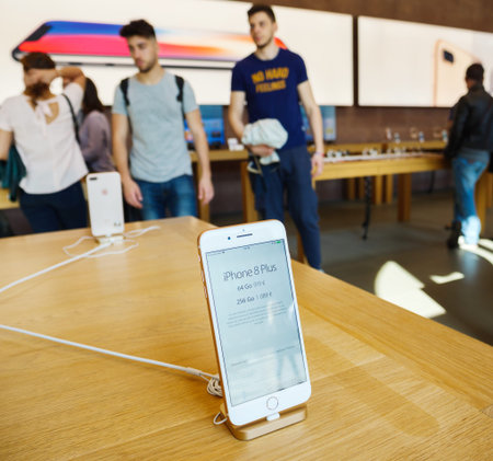 PARIS, FRANCE - SEP 22, 2017: New iPhone 8 and iPhone 8 Plus, as well the updated Apple Watch, Apple...