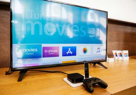 PARIS, FRANCE - SEP 22, 2017: New Apple TV goes on sale today in Apple Store with 4k screen shoping the Apple TV 4k displayのeditorial素材