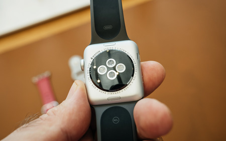 PARIS, FRANCE - SEP 22, 2017: New Apple Watch Series 3 goes on sale in Apple Store with LTE Sensor antenna and GPS and ceramic heart rate sensors  man looking atのeditorial素材