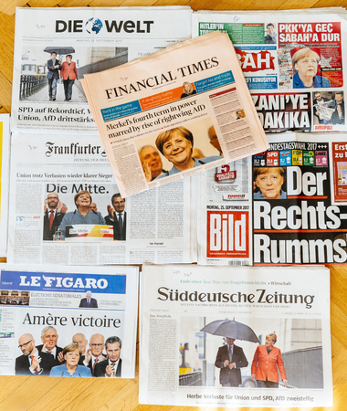 PARIS, FRANCE - SEP 25, 2017: International newspaper with Financial Times portrait of Angela Merkel after election in Germany for the Chancellor of Germany, the head of the federal governmentのeditorial素材