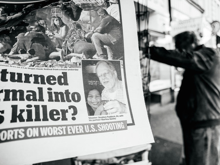 PARIS, FRANCE - OCT 3, 2017: Photo of killer Stephen Paddock in newspaper with socking title and photo at press kiosk about the 2017 Las Vegas Strip shooting in United States with about 60 fatalities and 527 injuriesのeditorial素材