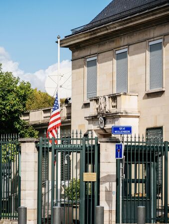 PARIS, FRANCE - OCT 3, 2017: US United States American Flag flying half-mast in court of the US Embassy after the 2017 Las Vegas Strip shooting in United States with about 60 fatalities and 527 injuriesのeditorial素材