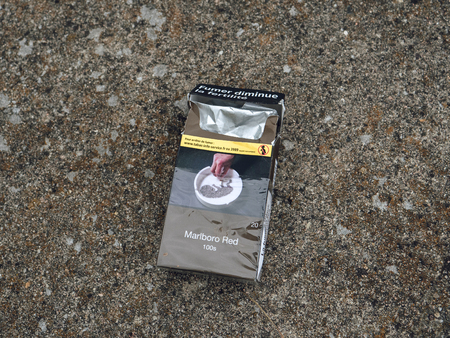 STRASBOURG, FRANCE - JUN 25, 2017: Empty cigarette pack informing in French about the negative effects of smoking on fertilityのeditorial素材