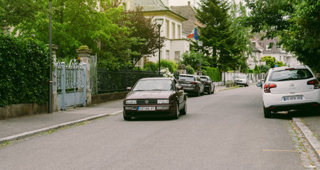 STRASBOURG, FRANCE - JUN 25, 2017: Vintage Volkswagen Scirocco coupe driving through an upper-class neighbourhood in Strasbourg, Franceのeditorial素材