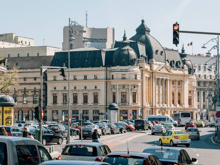 Busy traffic in downtown Bucharest around Central University Library housed in Carol I University Foundation buildingのeditorial素材