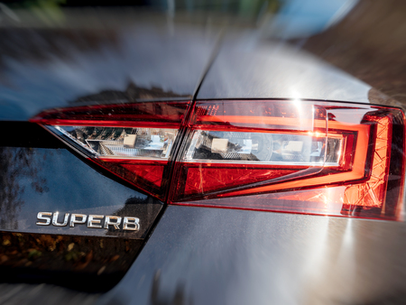 STRASBOURG, FRANCE - OCT 1, 2017: Rear view of Skoda Superb luxury limousine made by Skoda part of Volkswagen maroon topaz colorのeditorial素材