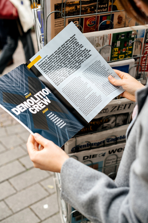 STRASBOURG, FRANCE - OCT 28, 2017: Woman reading The Economist business magazine at press kioskのeditorial素材