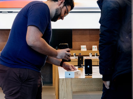 STRASBOURG, FRANCE - NOV 3, 2017: Apple Genius selling the latest Apple iPhone X to first customers in France  at Apple Storeのeditorial素材