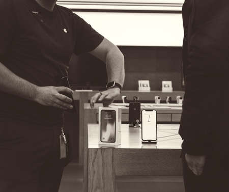 STRASBOURG, FRANCE - NOV 3, 2017: Apple Genius selling the latest Apple iPhone X to first customers in France  at Apple Storeのeditorial素材
