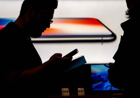STRASBOURG, FRANCE - NOV 3, 2017: Apple Genius selling the latest Apple iPhone X to first customers in France  at Apple Storeのeditorial素材