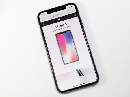PARIS, FRANCE - NOV 3, 2017: New Apple iPhone X 10 smartphone with Apple Store website on the OLED Super Retina Displayのeditorial素材