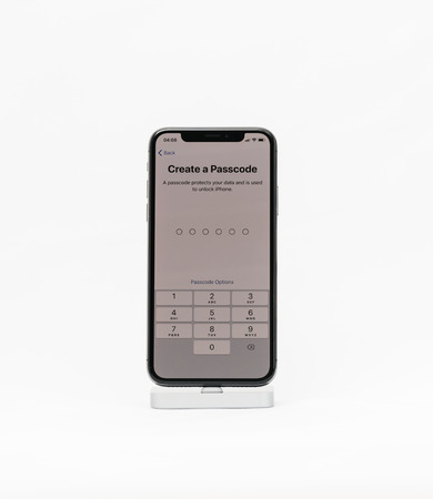 PARIS, FRANCE - NOV 5, 2017: New Apple iPhone X 10 smartphone isolated white background create a passcode menuのeditorial素材