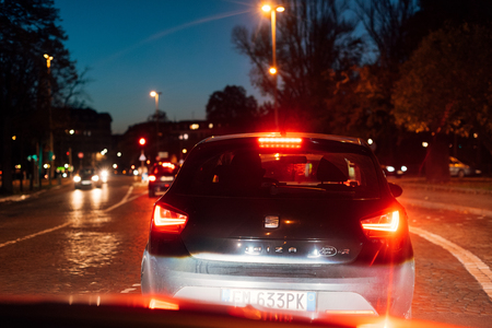 STRASBOURG, FRANCE - OCT 31, 2017: Beautiful bokeh in multiple colors at night - pov of a driver caught in a traffic jam with Seat Ibiza car in frontのeditorial素材