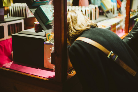 Woman smelling the traditional Christmas Tea at the Christmas Market in Strasbourg, Alsace Franceの写真素材