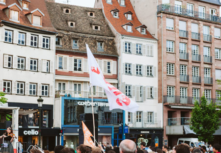 STRASBOURG, FRANCE - MAY 30, 2015: Jesus flag with house in background at March for Jesus the annual interdenominational event by Christiansのeditorial素材