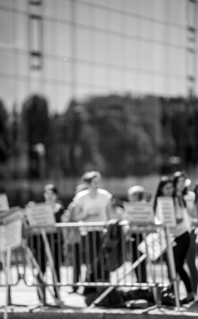Defocused protesters behind fence at protest in Franceの写真素材