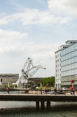 STRASBOURG, FRANCE - MAY 23, 2015: Presqu'Ile Malraux old Strasbourg docks with pedestrians admiring the architecture on a warm spring dayのeditorial素材
