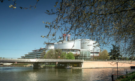 STRASBOURG, FRANCE - APR 15, 2017: European Court of Human Rights building and Ill River in Strasbourg, Franceのeditorial素材
