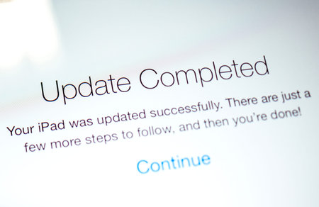 PARIS, FRANCE - SEP 18, 2014: Update completed for iPad message during latest iOS update from Apple...