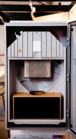 Open door of a central unit of a modern technology Central Vacuum Systems in modern home 
