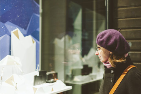 French elegant woman search for the Christmas gift in Jewelry shop selecting luxury fountain pens...