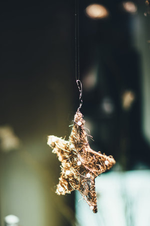 Unique handmade star made from gold floating above surface