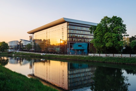 STRASBOURG, FRANCE - APR 21, 2017: Agora Council of Europe building in Strasbourg construction at sunset with sun reflected in windowのeditorial素材