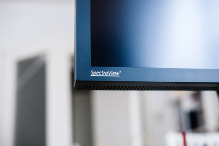 PARIS, FRANCE - JAN 9, 2017: Detail of professional Nec Spectraview Reference 322UHD 4k wide gamut monitor in a photostudio environmentのeditorial素材