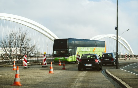 KEHL, GERMANY - JAN 16, 2017: VANHOLL Flixbus green bus on the border bridge between Germany and France transporting tourists to France - intercity low-cost bus service in Europeのeditorial素材