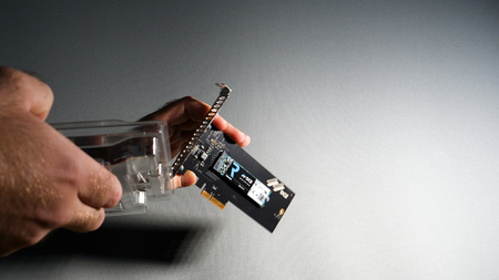 PARIS, FRANCE - FEB 7, 2018: Man unboxing Toshiba OCZ Technology rd400 new fast modern NVME ssd Solid state drive with pcie card adapterのeditorial素材