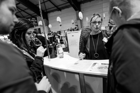 STRASBOURG, FRANCE - FEB 19, 2018: Friends tasting and buying French wine at the Vignerons independant English: Independent winemakers of France wine fair in Strasbourgのeditorial素材