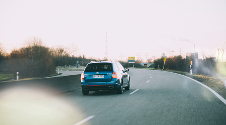 BADEN WURTTEMBERG, GERMANY - FEB 25, 2018: Rear view of beautiful blue painted Skoda Octavia wagon car on the German autobahn highway, driving very fastのeditorial素材