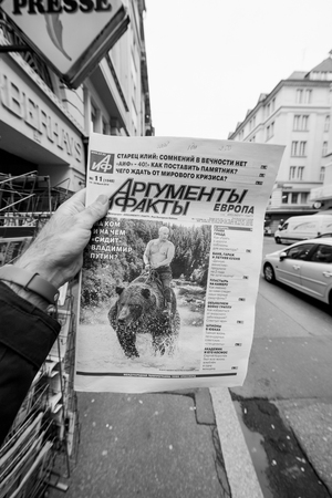 PARIS, FRANCE - MAR 15, 2018: Argumenty i Fakty russian newspaper featuring the photograph of Vladimir Putin on a Siberian grizzly bear before Russian Electionsのeditorial素材