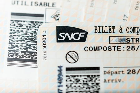 PARIS, FRANCE - JAN 14, 2015: Stack of multiple SNCF (Societe nationale des chemins de fer francais) train tickets seen from above randomly arranged on a table - close-upのeditorial素材
