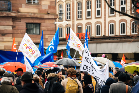 STRASBOURG, FRANCE  - MAR 22, 2018: Front view of young group with banner Education in danger at demonstration protest against Macron French government string of reforms mutiple trade unions on strikeのeditorial素材