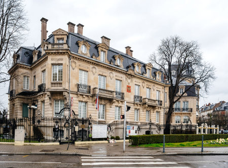 STRASBOURG, FRANCE - MAR 28, 2018: Cars driving in front Russian Consulate Embassy half-mast Russian Flag tribute mourning of victims fire at Zimnyaya Vishnya Winter Cherry shopping centre Kemerovoのeditorial素材