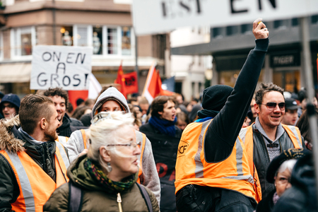 STRASBOURG, FRANCE  - MAR 22, 2018: SNCF French rail workers at demonstration protest against Macron French government string of reforms, mutiple trade unions called public workers to strikeのeditorial素材