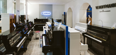 TRIER, GERMANY - FEB 21, 2015: Wide image with luxury piano shop musical instrument store selling exclusive pianos and royal grand piano by W.Hoffmann by C. Bechsteinand Yamaha Pianoworldのeditorial素材