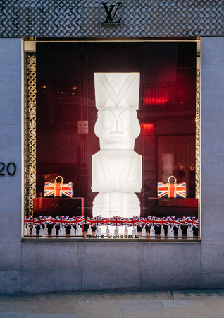 LONDON, UNITED KINGDOM - MAY 18, 2018: Louis Vuitton celebrates the royal wedding of Prince Harry and Ms Meghan Markle with animated British Union Jack flags in their storefront flagship storeのeditorial素材