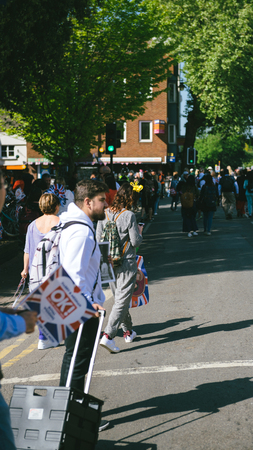 WINDSOR, UNITED KINGDOM - MAY 19, 2018: Man sells Royal Couple portrait souvenirs during royal wedding marriage celebration of Prince Harry, Duke of Sussex and the Duchess of Sussex Meghan Markleのeditorial素材