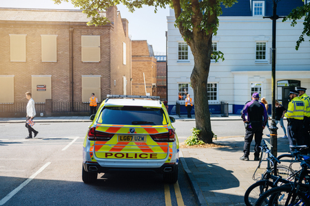 WINDSOR, BERKSHIRE, UNITED KINGDOM - MAY 19, 2018: BMW police SUV surveilleing street during royal wedding marriage celebration of Prince Harry, Duke of Sussex and the Duchess of Sussex Meghan Markleのeditorial素材